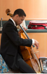 Caleb Middlebrook plays his cello for a crowd assembled at __________ (Photo by Middlebrook).