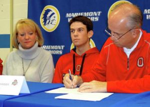 Will, sitting in between his mother Sarah Grimmer, and father Kevin Grimmer, officially signs to play golf at The Ohio State University. (PHOTO BY MARIEMONTSCHOOLS.ORG)