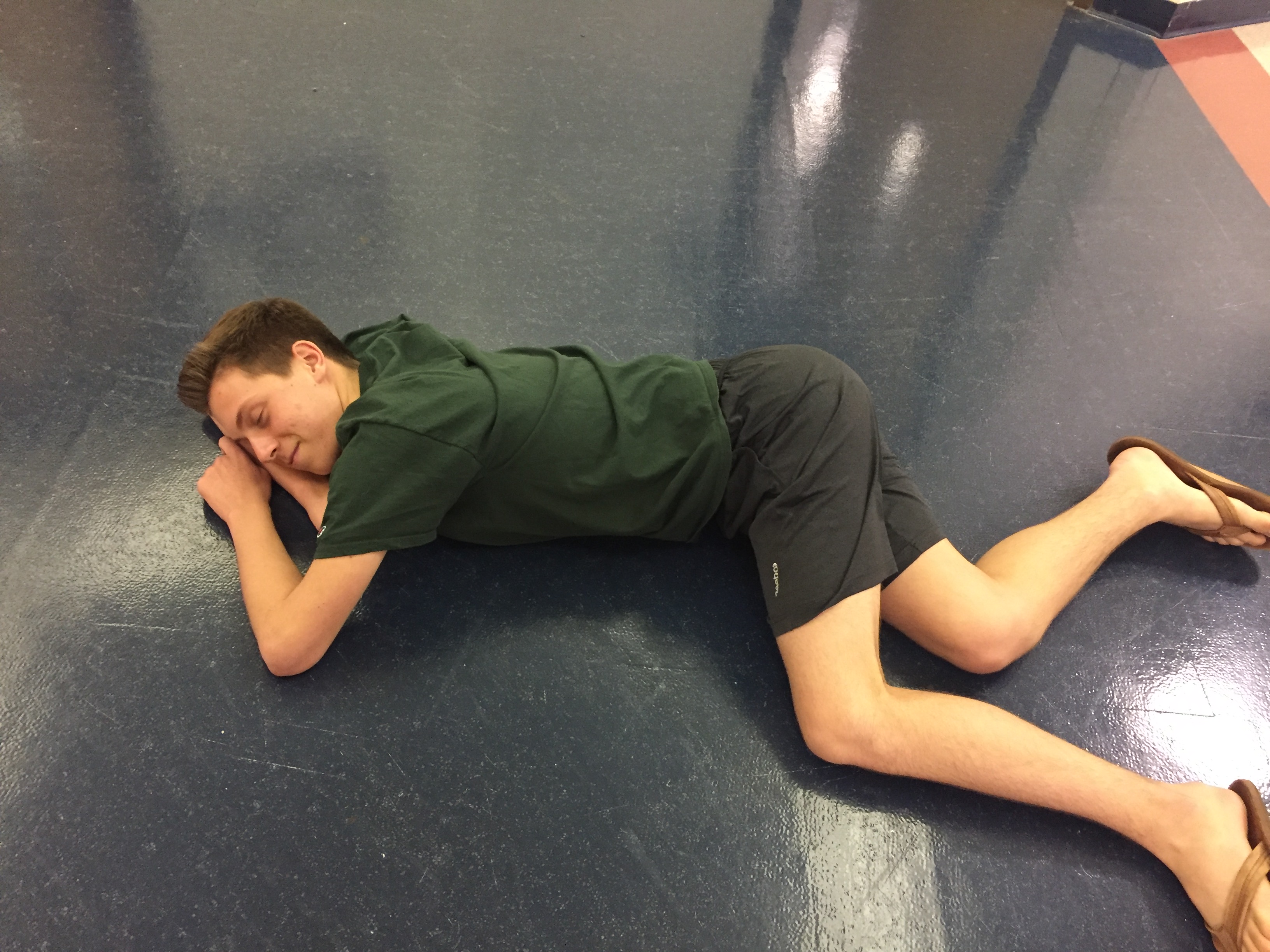 Junior Alex Wilson naps in the middle of the hallway. Who knows what he's dreaming about? (PHOTO BY KAPCAR)